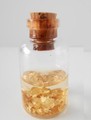 Gold flakes preserved in alcohol solution