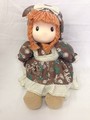 Doll with brown-white dress