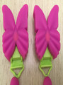 Picture showing the new clip and recalled clip.  The image on the left is the new clip and is identified by a thicker D-ring and ribbon material while the recalled clip on the right is identified by a narrow D-ring and ribbon material.