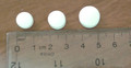 Tridural unmarked tablets, showing 3 white tablets with a ruler placed under them. From the left, the first tablet is blank; the second tablet is blank; the third tablet is blank.