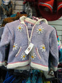 Pacapopskidz children’s sweater showing the waist drawstring still in place and the hood drawstring removed