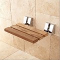Shower seat with chrome finish on support rods and bracket covers