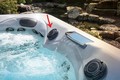Image of the recalled valve cap location below diverter handle on a Master Spas spa