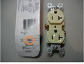 Image 1. Front view of recalled receptacle with packaging and model number circled