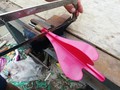 Example of how to destroy lawn darts with a hacksaw