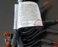 Location of date code (circled) on white tag attached to light string